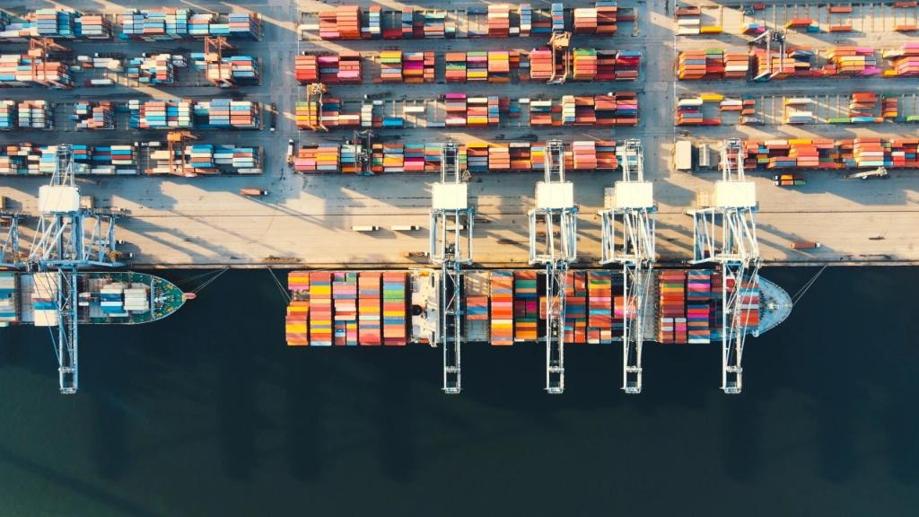 Container ship berthed at port aerial view